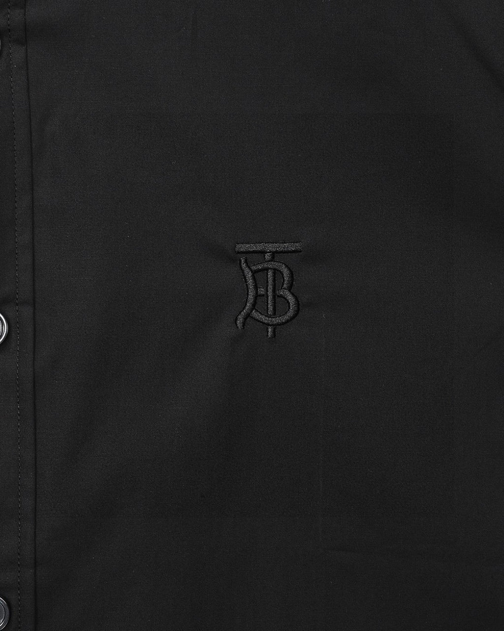 Burberry embroidered TB logo on dark button-up shirt front