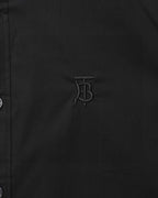 Burberry embroidered TB logo on dark button-up shirt front