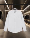 White long-sleeve button-up shirt with point collar and chest patch pocket
