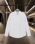 White long-sleeve button-up shirt with point collar and chest patch pocket