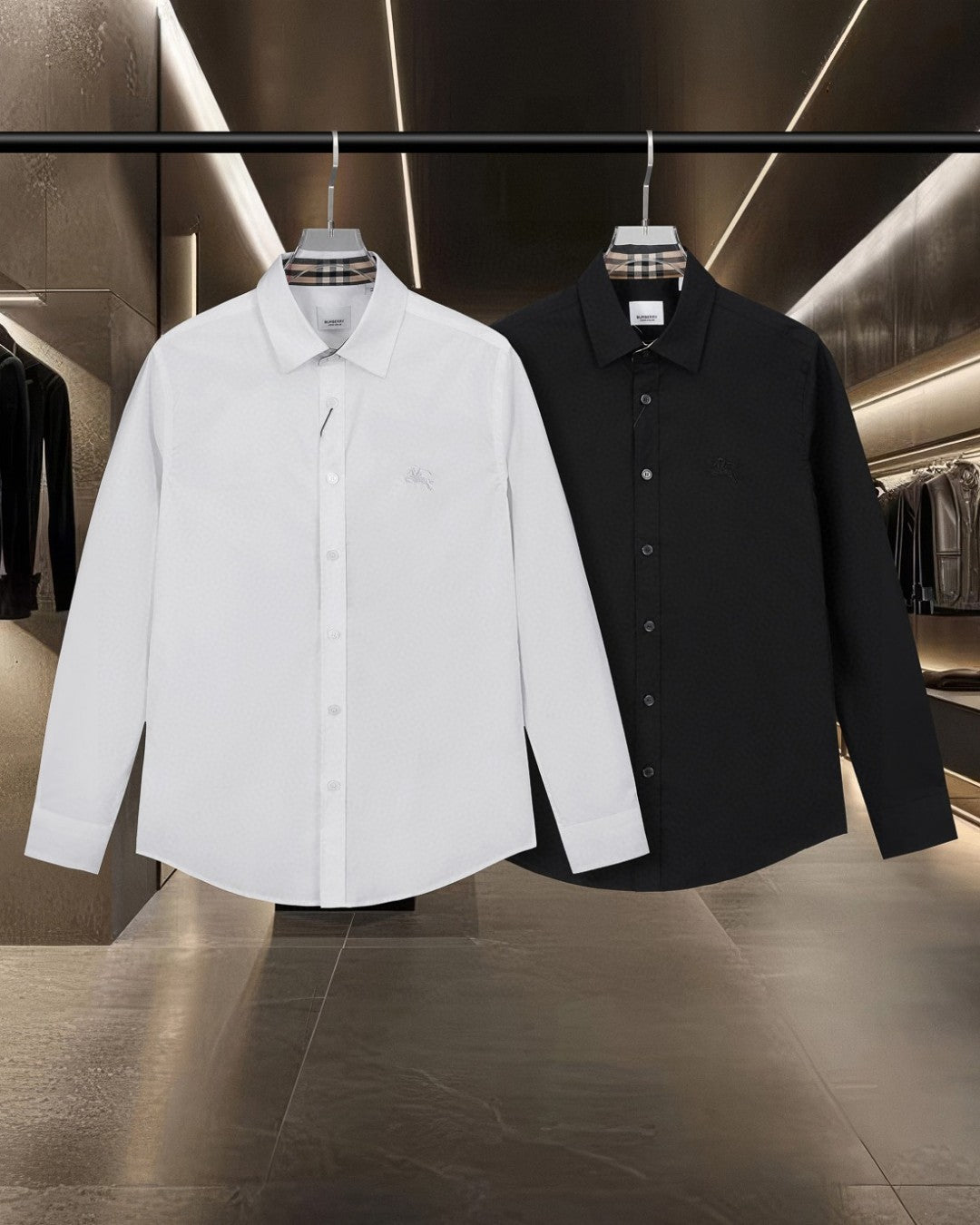 Burberry long-sleeve button-up shirts, white and black on display