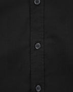 Black shirt front with three visible buttons and vertical stitched placket