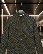 Plaid button-up shirt with pointed collar and buttons, dark green and yellow grid