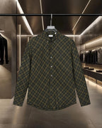 Plaid button-up shirt with long sleeves, dark green and yellow grid, button front