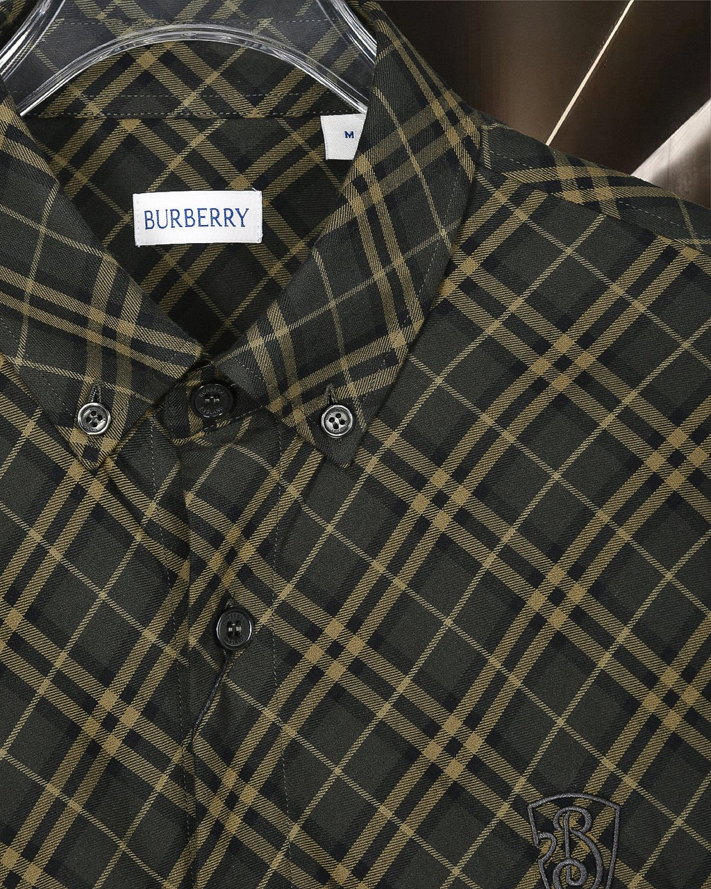 Burberry plaid button-up shirt front, dark green and yellow grid, button cuffs