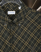 Burberry plaid button-up shirt front, dark green and yellow grid, button cuffs