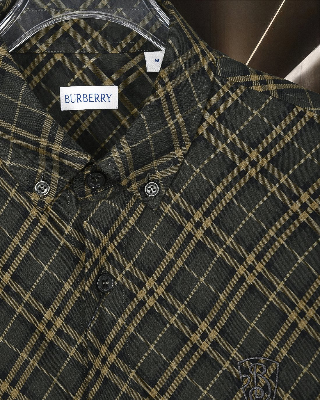 Burberry plaid button-up shirt front, dark green and yellow grid, button cuffs