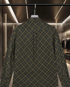 Plaid button-up shirt back view with long sleeves, dark green and yellow grid pattern