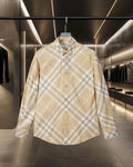 Long-sleeve button-up shirt in beige plaid with buttoned collar and placket