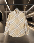 Long-sleeve button-up shirt in beige plaid with buttoned collar and placket