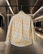 Long-sleeve button-up shirt in beige plaid, back view with full yoke