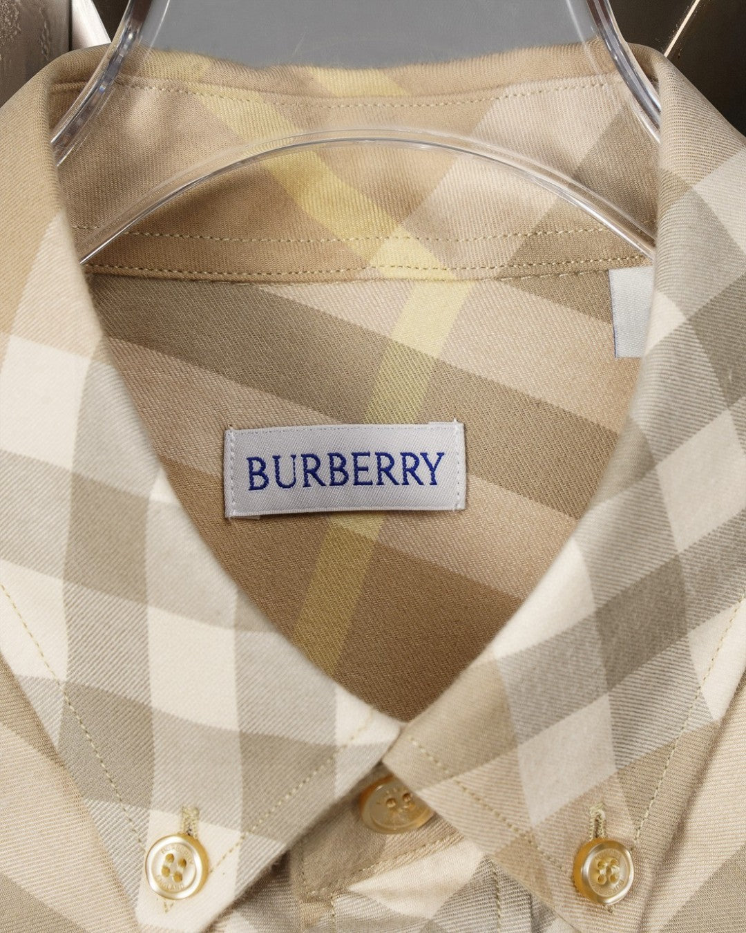 Long-sleeve shirt in beige plaid with interior neck label and gold buttons