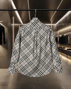 Long-sleeve button-up check shirt, back view, white with black and blue plaid