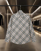 Long-sleeve button-up check shirt, white with black and blue plaid