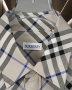Long-sleeve check shirt collar and label, white label on black and blue plaid