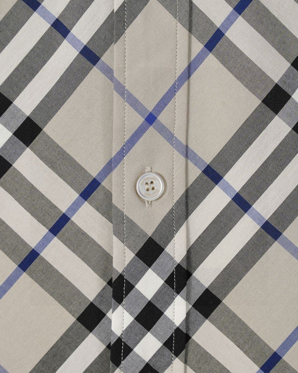 Long-sleeve check shirt button placket detail, white with black and blue plaid