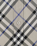 Long-sleeve check shirt button placket detail, white with black and blue plaid