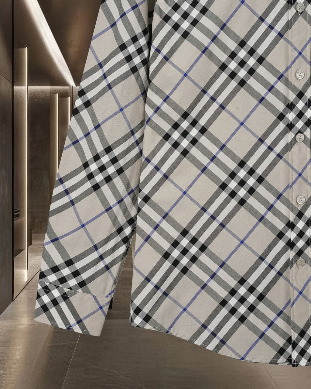 Long-sleeve check shirt side view, white with black and blue plaid pattern