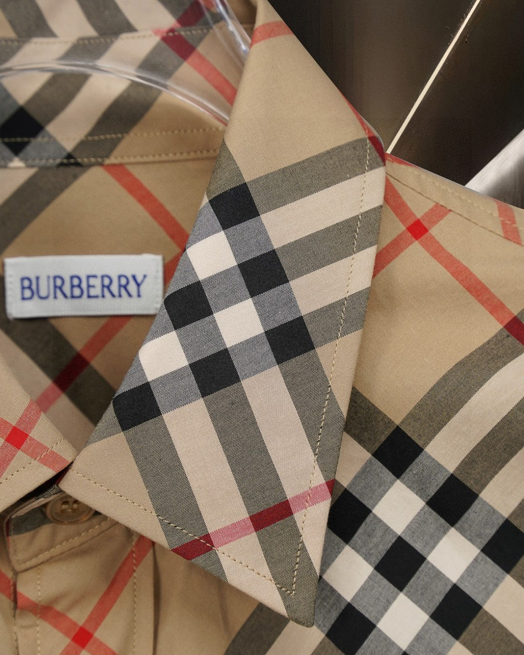 Burberry plaid shirt sleeve cuff detail with logo label, beige with black and red checks