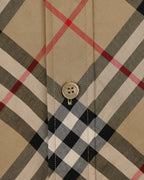 Burberry plaid shirt front placket detail with three buttons on beige and black checks