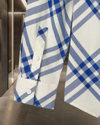 Plaid shirt front with pocket detail and button at cuff, blue and white