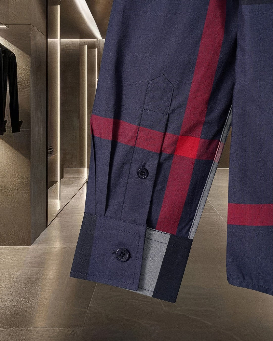 Burberry long coat sleeve with navy check, red stripe, and buttoned cuff