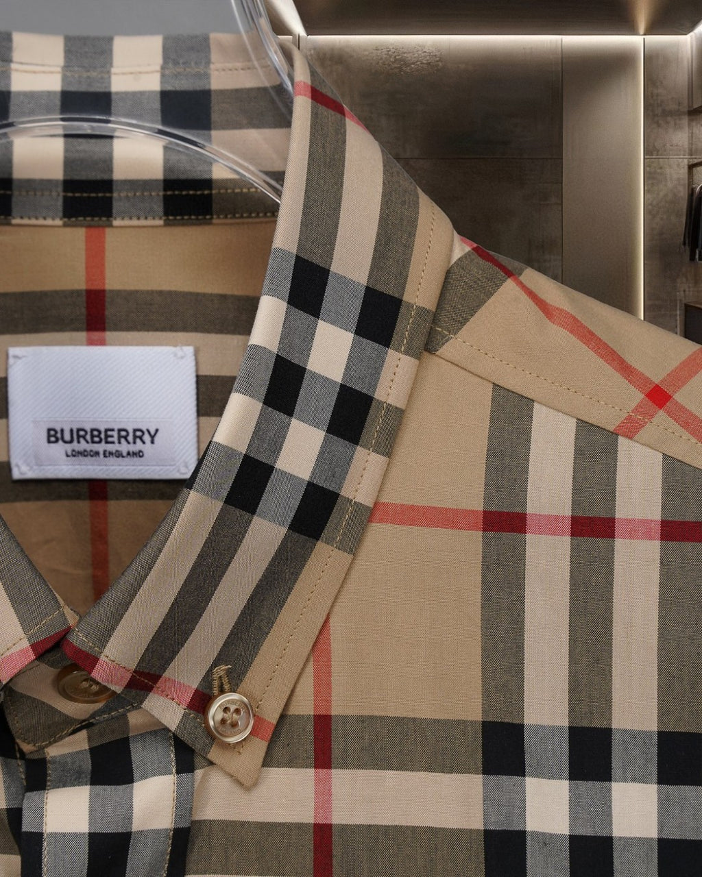 Plaid button-up shirt shoulder seam with cuff button detail
