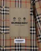 Plaid button-up shirt with beige Burberry logo label on chest pocket