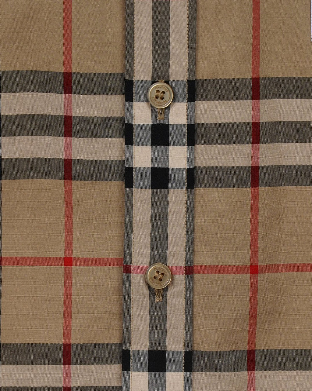 Plaid shirt front placket with gold-tone buttons