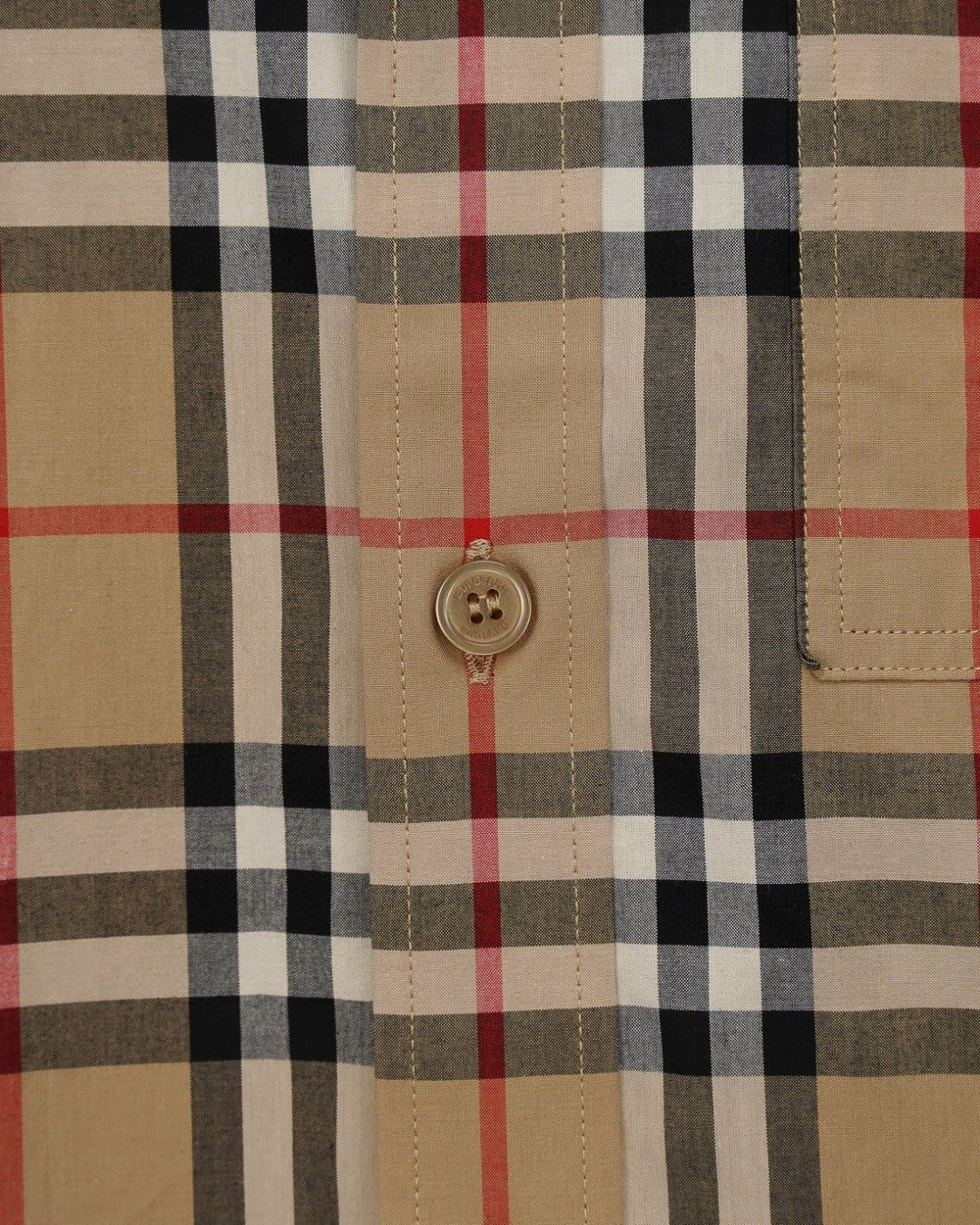 Burberry plaid button-up shirt front with logo button and check pattern