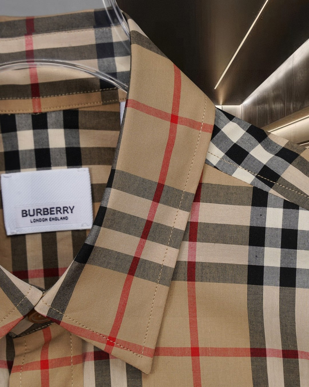 Burberry plaid button-up shirt, brand label at placket