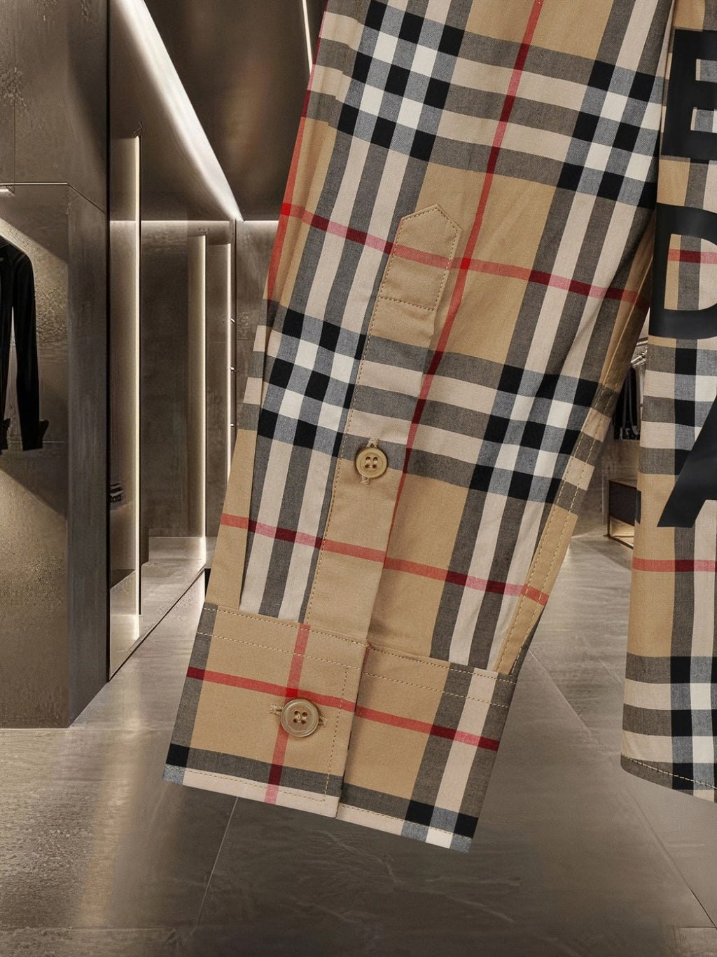 Burberry long plaid coat with visible buttons at hem