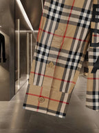 Burberry long plaid coat with visible buttons at hem