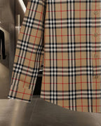 Burberry long plaid coat with buttoned front and cuff