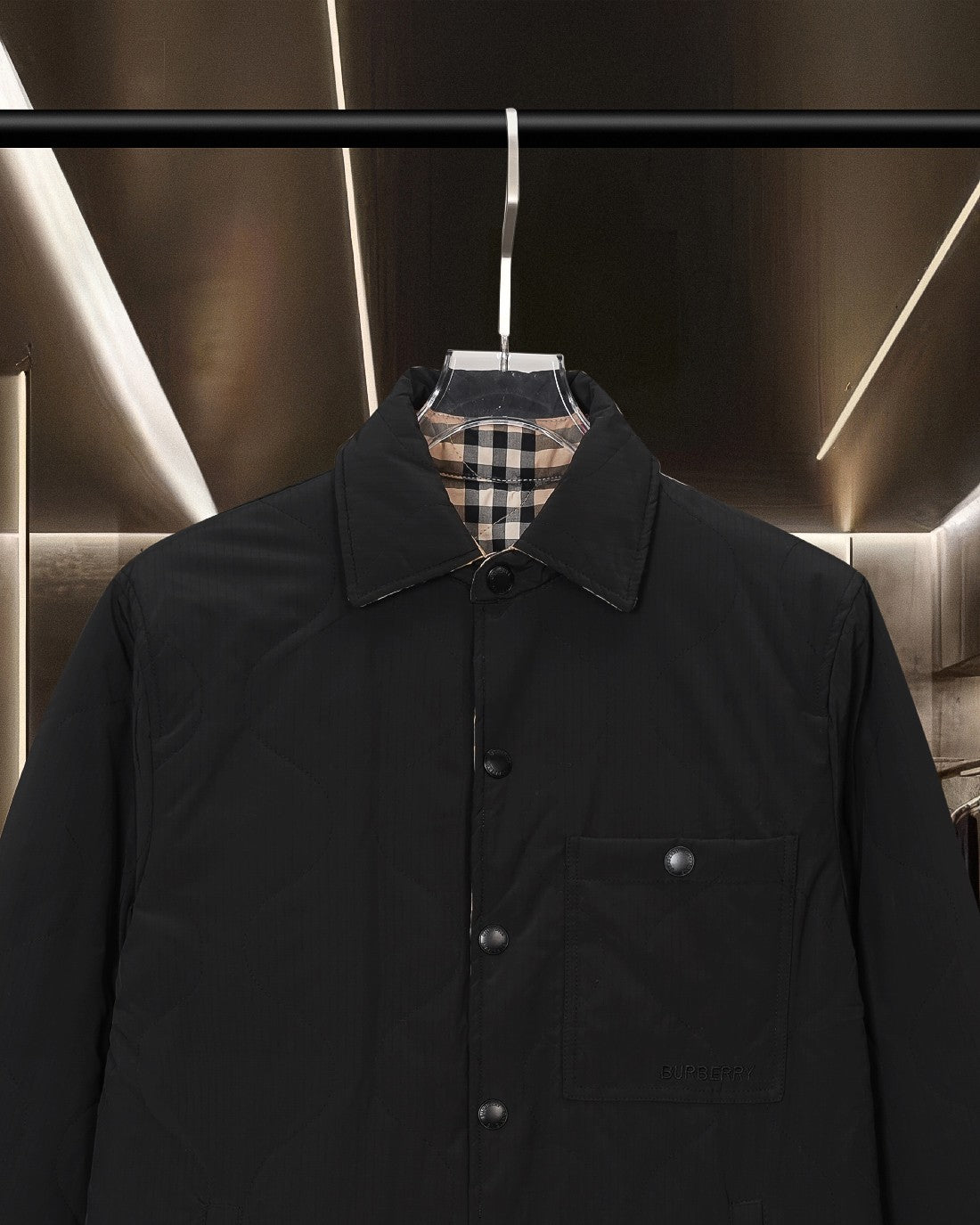 Burberry long coat in black, front close-up with button placket and chest pocket