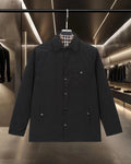 Burberry long coat in black with plaid lining, button front and spread collar
