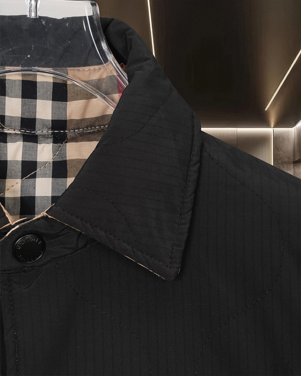 Burberry long coat sleeve cuff detail with black fabric and plaid inner collar