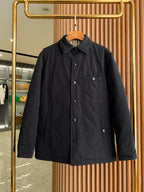 Black long coat jacket with spread collar, button front, and chest pocket