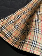 Long jacket lining with beige, black, red, and navy plaid panel and stitched hem