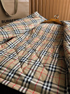 Long jacket with plaid lining and stand collar, button-front area visible