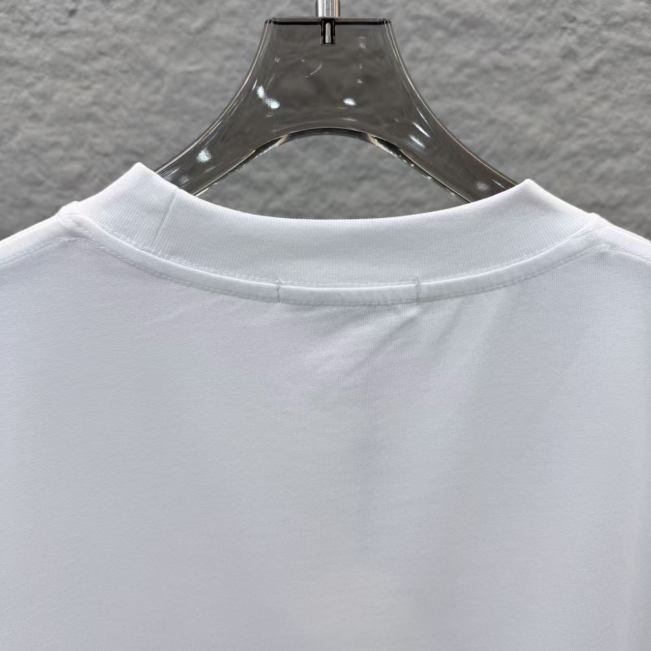 White Fendi short-sleeve T-shirt close-up of crew neck collar seam