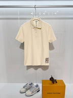 Burberry short-sleeve polo shirt in light cream, button placket and collar detail