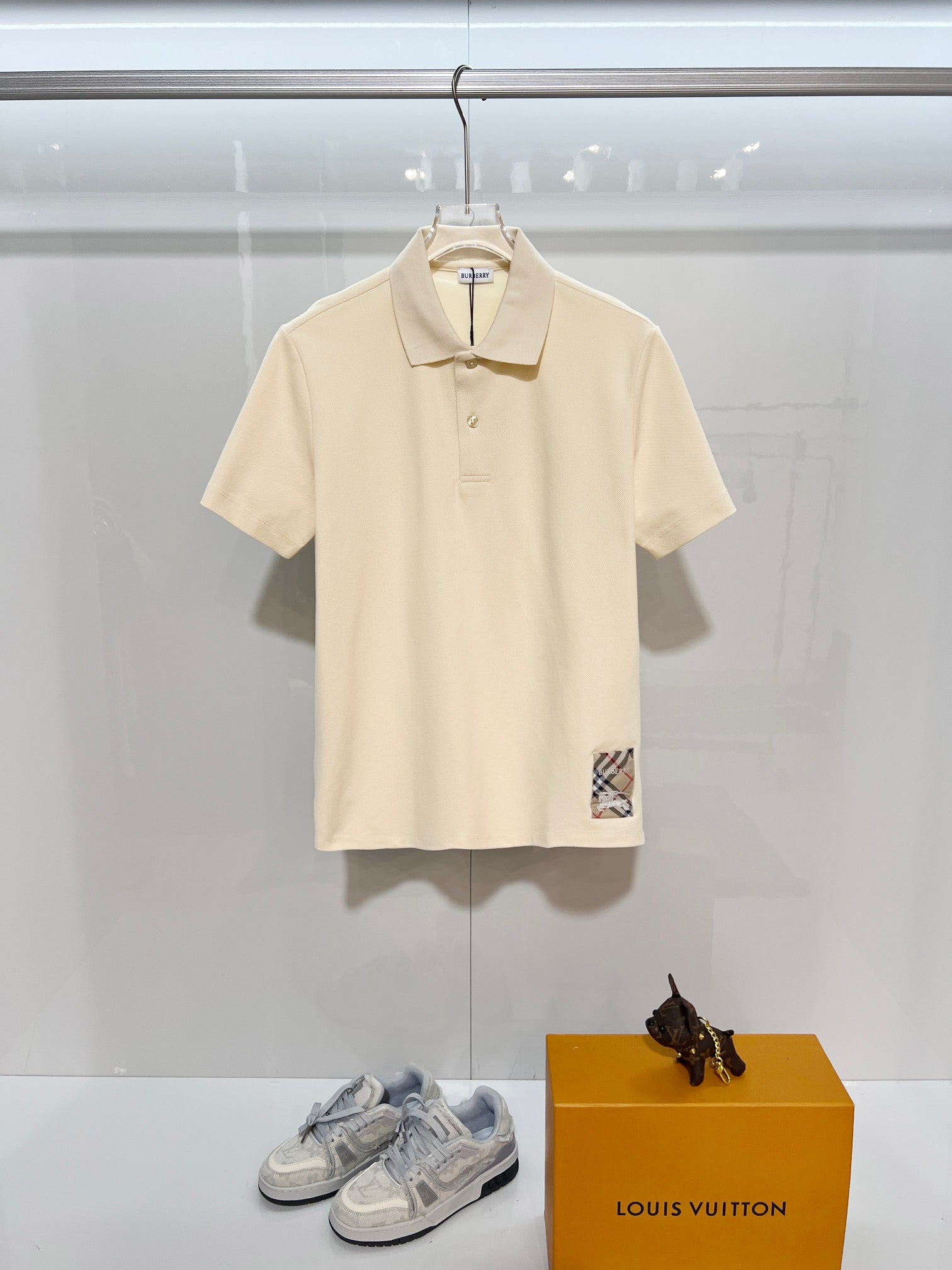 Burberry short-sleeve polo shirt in light cream, button placket and collar detail