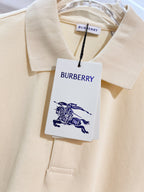 Burberry short-sleeve polo shirt in light cream, neckline fabric with hanging tag