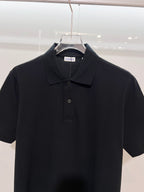 Black polo shirt with buttoned collar and Burberry neck label