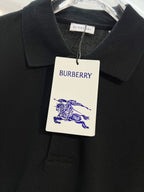 Black polo shirt with Burberry neck tag and blue horse logo on white label