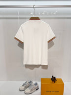 Burberry short-sleeve polo shirt in white, back view with striped trim