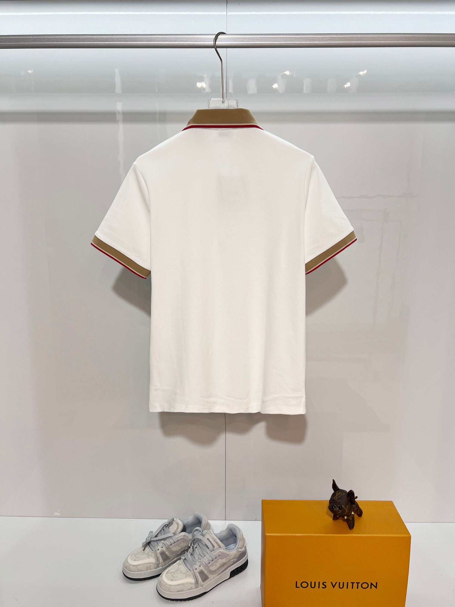 Burberry short-sleeve polo shirt in white, back view with striped trim