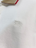 Burberry polo shirt chest with small embroidered logo on white fabric