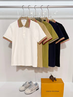 Short-sleeve polo shirts on hangers in white, olive, and navy with red-trim collar.